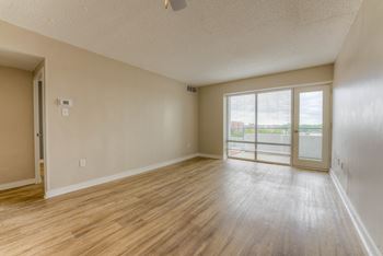 A room with wooden flooring and a ceiling fan.at Iris Luxury Apartments, Memphis Tennessee  